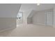 Bright bedroom with dormer window, carpet, and a closet at 125 Cotton Fields Ln # 26, Fuquay Varina, NC 27526