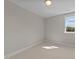 Well-lit bedroom with neutral walls and carpet at 125 Cotton Fields Ln # 26, Fuquay Varina, NC 27526