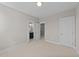 Spacious bedroom with carpeting, door to bathroom, and ample closet space at 125 Cotton Fields Ln # 26, Fuquay Varina, NC 27526