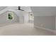 Bright bedroom with sloped ceilings, ceiling fan, and multiple windows at 125 Cotton Fields Ln # 26, Fuquay Varina, NC 27526