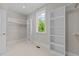 Walk-in closet with built-in shelving and hanging rods at 125 Cotton Fields Ln # 26, Fuquay Varina, NC 27526