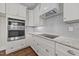 Modern kitchen features stainless steel appliances and granite countertops at 125 Cotton Fields Ln # 26, Fuquay Varina, NC 27526