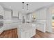 Island kitchen with white cabinets and granite countertops at 125 Cotton Fields Ln # 26, Fuquay Varina, NC 27526