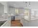 Spacious kitchen boasts granite countertops, stainless steel appliances, and an island at 125 Cotton Fields Ln # 26, Fuquay Varina, NC 27526