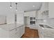 Modern kitchen with white cabinets, granite countertops, and stainless steel appliances at 125 Cotton Fields Ln # 26, Fuquay Varina, NC 27526