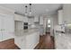 Modern kitchen with white cabinets, granite countertops, and stainless steel appliances at 125 Cotton Fields Ln # 26, Fuquay Varina, NC 27526