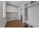 Laundry room with built-in cabinets and bench at 125 Cotton Fields Ln # 26, Fuquay Varina, NC 27526