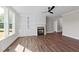 Open living room featuring hardwood floors and a fireplace with built-in shelving at 125 Cotton Fields Ln # 26, Fuquay Varina, NC 27526