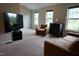 Spacious bonus room with large TV, comfy seating, and ample natural light at 901 Wildflower Ridge Rd, Wake Forest, NC 27587