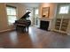 Elegant living room with hardwood floors, fireplace, and built-ins at 901 Wildflower Ridge Rd, Wake Forest, NC 27587