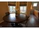 Round dining table with chairs in a bright dining area at 901 Wildflower Ridge Rd, Wake Forest, NC 27587