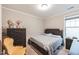 Bright bedroom with a bed and dresser at 901 Wildflower Ridge Rd, Wake Forest, NC 27587