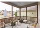 Relaxing screened porch with seating and room for grilling at 901 Wildflower Ridge Rd, Wake Forest, NC 27587