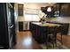 Island kitchen with stainless steel appliances and hardwood floors at 901 Wildflower Ridge Rd, Wake Forest, NC 27587
