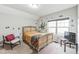 Cozy bedroom with a comfortable bed and a chair at 901 Wildflower Ridge Rd, Wake Forest, NC 27587