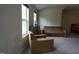 Bright bonus room featuring two comfy chairs and a sofa at 901 Wildflower Ridge Rd, Wake Forest, NC 27587