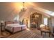 Large bedroom with brick fireplace and access to bathroom at 6720 Mebane Oaks Rd, Mebane, NC 27302