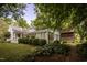 A charming historical home with lush landscaping and brick pathways at 6720 Mebane Oaks Rd, Mebane, NC 27302