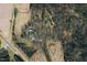 Aerial view of house and large lot with surrounding trees and fields at 6720 Mebane Oaks Rd, Mebane, NC 27302