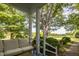 Relaxing porch with comfortable seating overlooking a scenic landscape at 6720 Mebane Oaks Rd, Mebane, NC 27302