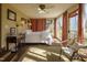 Sunlit bedroom with brick flooring and garden view at 6720 Mebane Oaks Rd, Mebane, NC 27302
