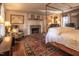 Comfortable bedroom with fireplace and sitting area at 6720 Mebane Oaks Rd, Mebane, NC 27302