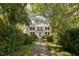 Brick pathway to charming white farmhouse at 6720 Mebane Oaks Rd, Mebane, NC 27302