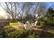 Brick patio with comfortable seating for outdoor entertaining at 6720 Mebane Oaks Rd, Mebane, NC 27302