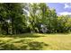 White home viewed from a distance across a lawn at 6720 Mebane Oaks Rd, Mebane, NC 27302