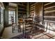 Cozy dining area with a wooden table and chairs, exposed log wall at 6720 Mebane Oaks Rd, Mebane, NC 27302