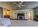 Spacious bedroom with fireplace and ensuite bathroom access at 6720 Mebane Oaks Rd, Mebane, NC 27302
