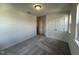 Well-lit bedroom with double door closet and gray carpeting at 352 Chestnut Oak Ln, Lillington, NC 27546