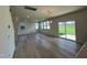 Bright dining room with hardwood floors and sliding glass doors leading to backyard at 352 Chestnut Oak Ln, Lillington, NC 27546