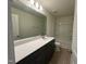 Modern bathroom boasts a double vanity and a bathtub at 352 Chestnut Oak Ln, Lillington, NC 27546