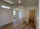 Light and airy entryway with powder room and views to the living room at 352 Chestnut Oak Ln, Lillington, NC 27546