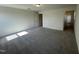 Spacious bedroom with grey carpet and access to hallway bathroom at 352 Chestnut Oak Ln, Lillington, NC 27546