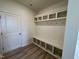Built-in bench with cubbies and hooks, perfect for storage and organization at 352 Chestnut Oak Ln, Lillington, NC 27546