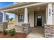 House exterior with front porch and stone accents at 127 Hillwood Dr, Sanford, NC 27332