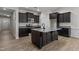 Modern kitchen with island, stainless steel appliances, and dark cabinetry at 127 Hillwood Dr, Sanford, NC 27332