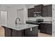 Modern kitchen with island, granite countertops, and dark cabinetry at 127 Hillwood Dr, Sanford, NC 27332