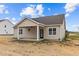 Rear view of house featuring covered patio, and neutral siding at 127 Hillwood Dr, Sanford, NC 27332
