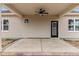 Covered patio with ceiling fan, access door, and brick base at 127 Hillwood Dr, Sanford, NC 27332