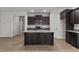 Modern kitchen with island, stainless steel appliances, and dark cabinetry at 127 Hillwood Dr, Sanford, NC 27332