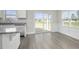 Kitchen dining area with hardwood floors and sliding glass doors to patio at 53 Hillwood Dr, Sanford, NC 27332