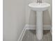 Powder room features a pedestal sink and grey floor tile at 53 Hillwood Dr, Sanford, NC 27332