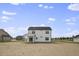Rear view of two-story house, showcasing backyard at 53 Hillwood Dr, Sanford, NC 27332
