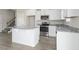 Kitchen island with granite countertop and white cabinets at 53 Hillwood Dr, Sanford, NC 27332