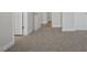 Carpeted hallway with doors to bedrooms and other rooms at 53 Hillwood Dr, Sanford, NC 27332