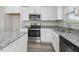 Modern kitchen with stainless steel appliances and granite countertops at 53 Hillwood Dr, Sanford, NC 27332