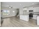 Open concept kitchen with island and stainless steel appliances at 53 Hillwood Dr, Sanford, NC 27332